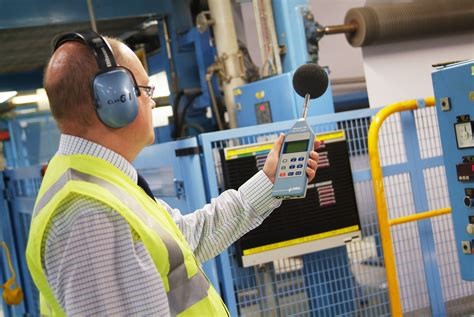 A professional doing a noise assessment in a New Zealand factory.